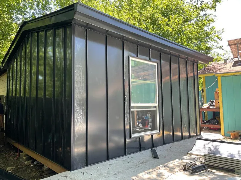 Black standing seam metal wall panels for Roof Inspection in Byron